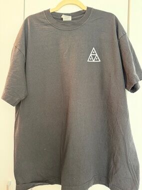 HUF Black Short Sleeve Tee with Small White Triangle Logo on Chest